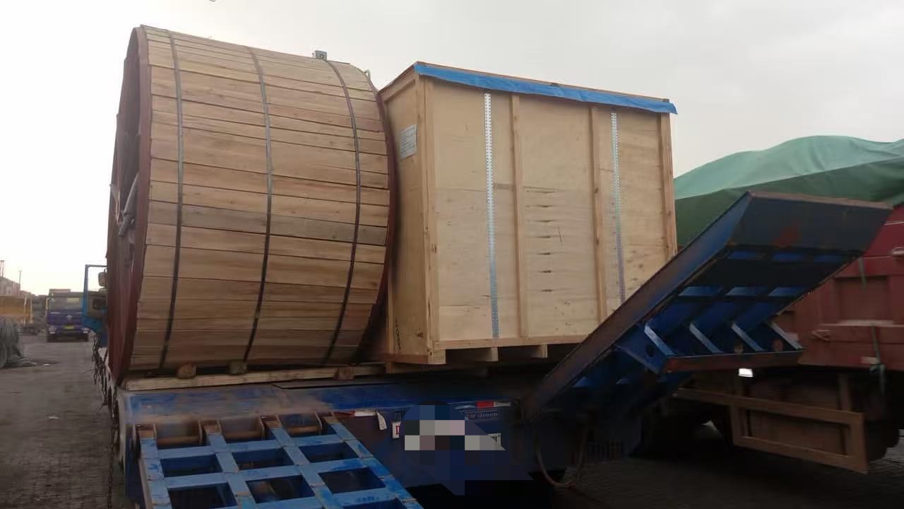 Cable spool and crate on lowbed