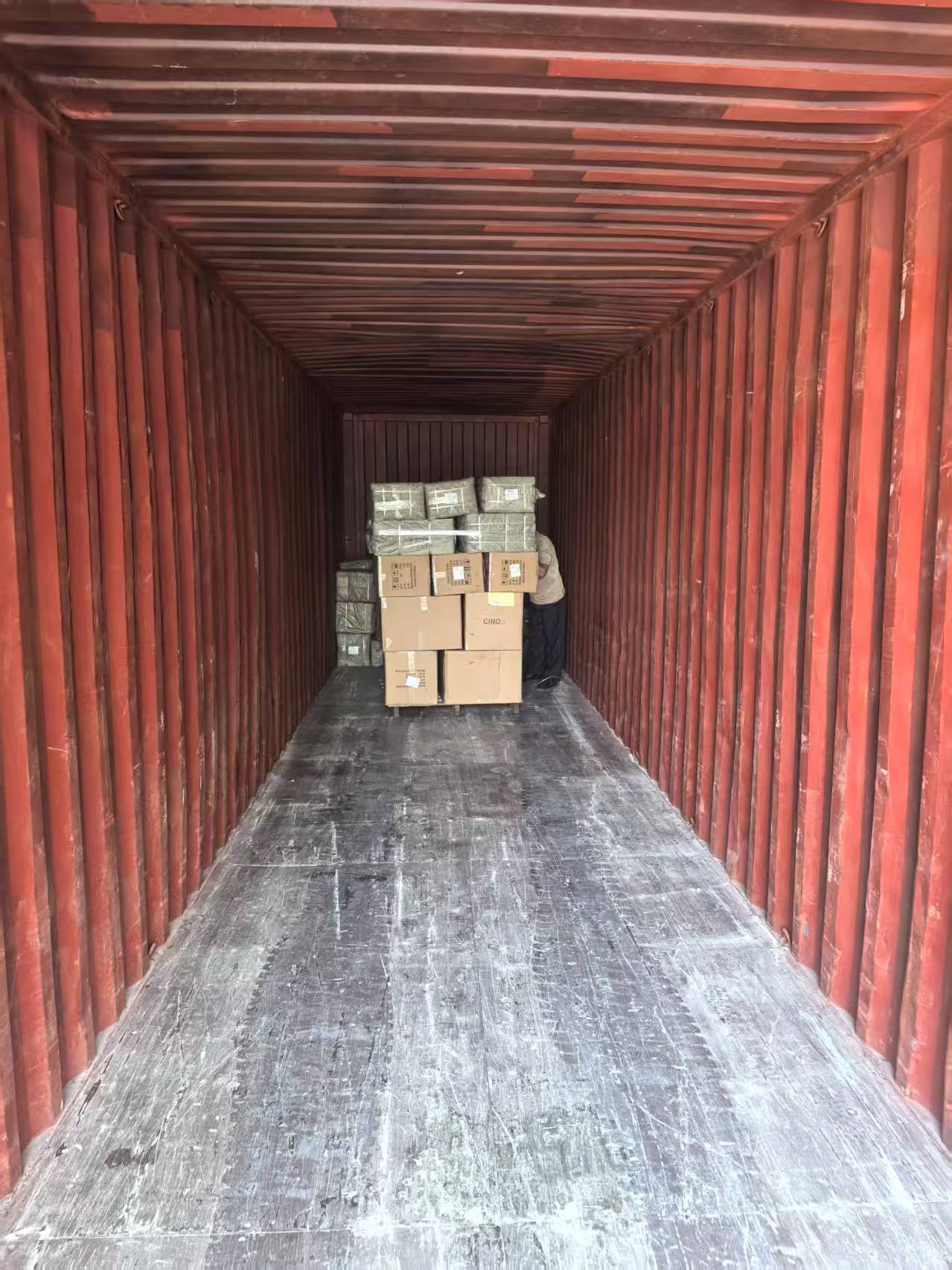 LCL cargo being carefully loaded and consolidated into a container for shipping to Luanda