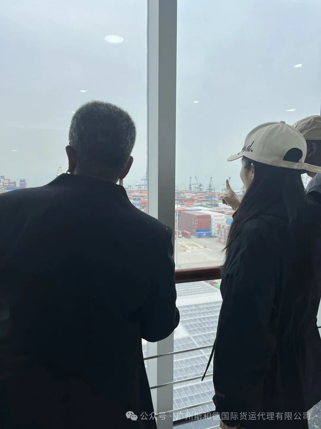 SPEED INT'L logistics experts discussing the transport plan with a view of the port