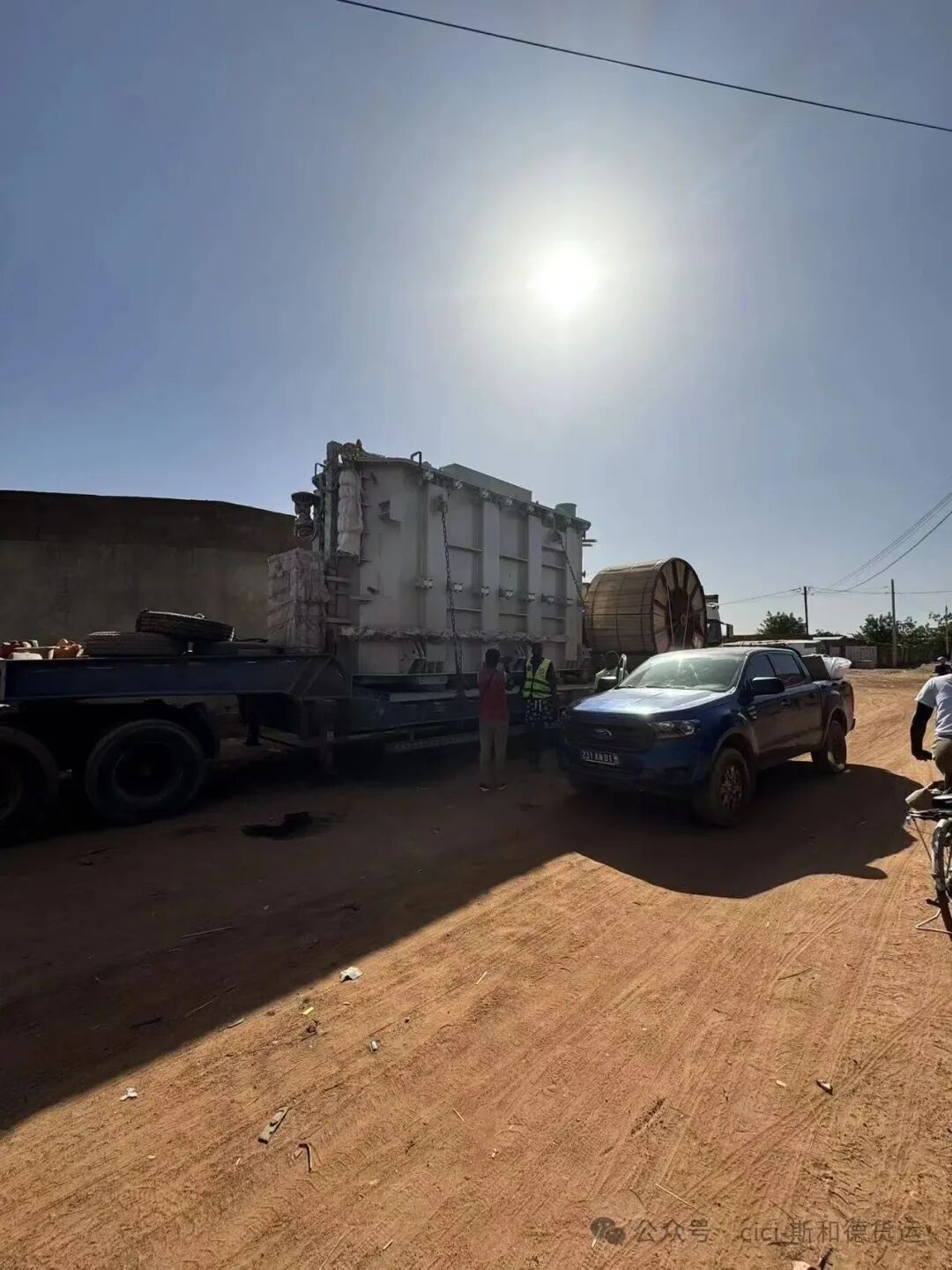 Project cargo parked at the site waiting for heavy crane scheduling under security watch