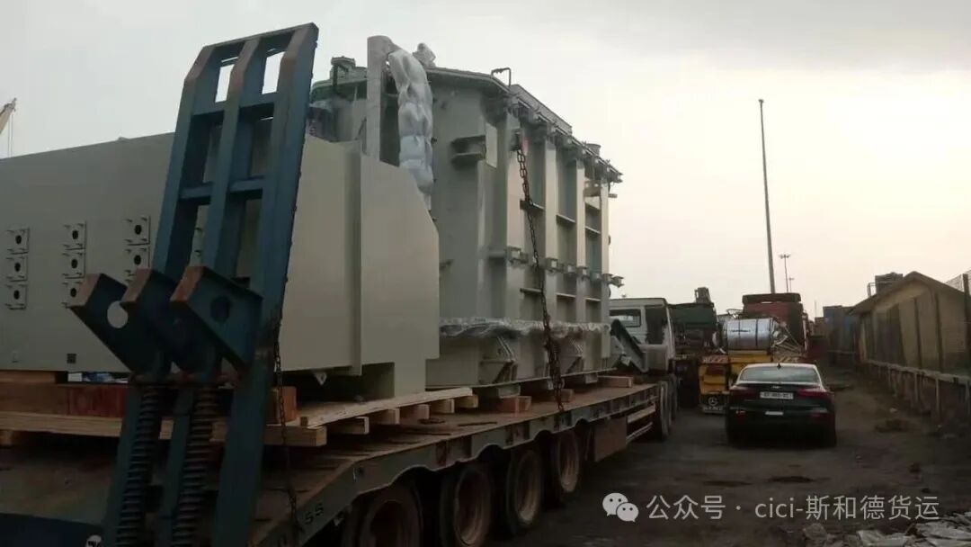 Heavy-duty convoy waiting at the Ghana-Burkina Faso border for customs clearance