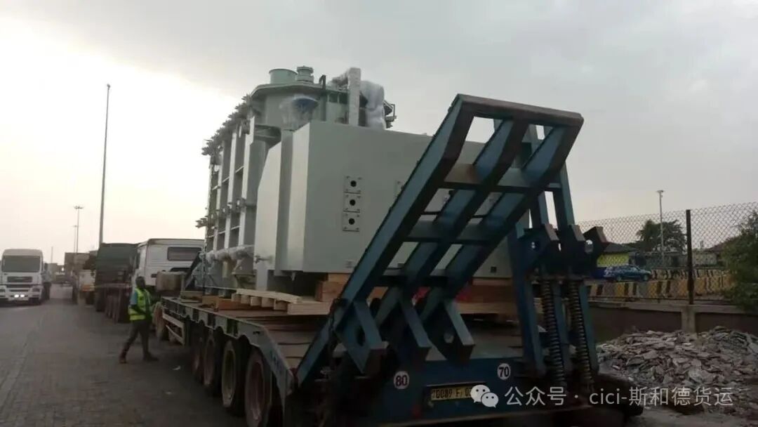 Heavy haul truck carrying a transformer broken down on a West African transit route