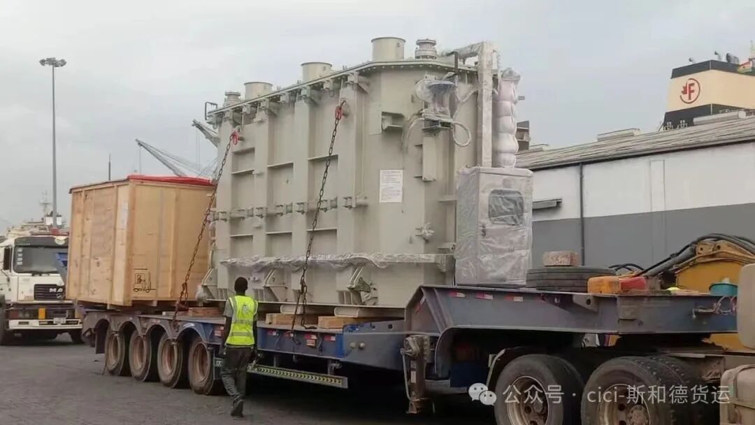 Transformer and wooden crates dispatched on a multi-axle trailer from Tema Port